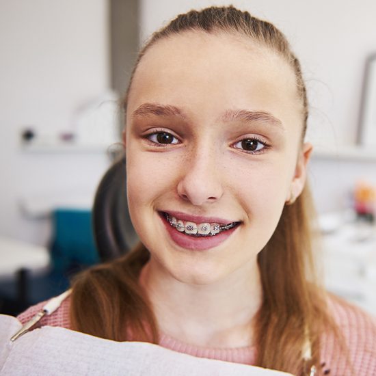Smiling teen girl in orthodontic office