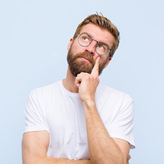 Portrait of man wondering about cost of Invisalign in Derry