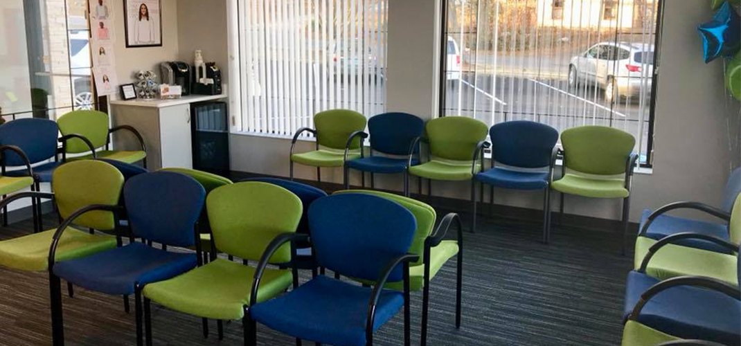 Seating and complimentary beverage bar in waiting room