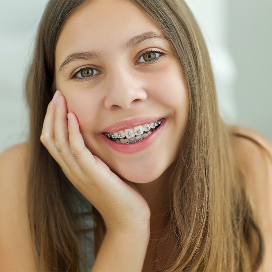 Teen girl with self ligating braces sharing smile