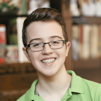 Preteen boy with traditional braces