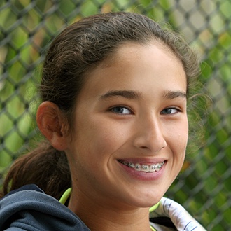 Teen girl with braces smiling